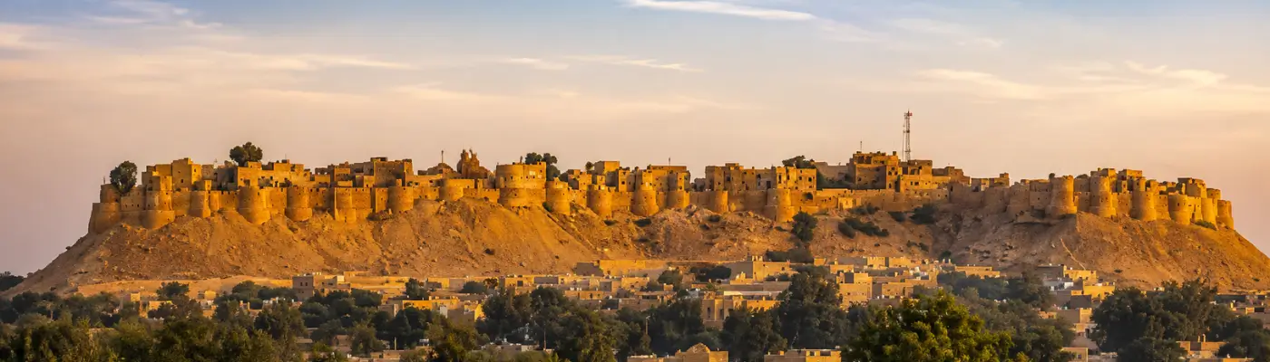 Golden sandstone walls of Jaisalmer Fort at sunset
